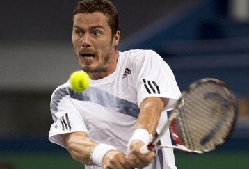 SHANGHAI, CHINA - OCTOBER 12:  Marat Safin of Russia returns a shot to Mao-Xin Gong of China during day two of 2009 Shanghai ATP Masters 1000 at the Qi Zhong Tennis Centre in Shanghai.  (Photo by Victor Fraile/Getty Images)