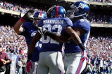 EAST RUTHERFORD, NJ - OCTOBER 11:  Mario Manningham #82 of the New York Giants celebrates his touchdown against the Oakland Raiders with his teammates on October 11, 2009 at Giants Stadium in East Rutherford, New Jersey.  (Photo by Jim McIsaac/Getty Images)