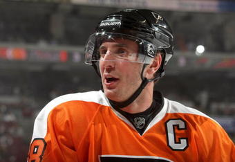 PHILADELPHIA - SEPTEMBER 29:  Mike Richards #18 of the Philadelphia Flyers looks on from the bench area during NHL preseason game action against the Minnesota Wild at the Wachovia Center on September 29, 2009 in Philadelphia, Pennsylvania.  The Wild defeated the Flyers 5-4 in shootout overtime. (Photo by Bruce Bennett/Getty Images)