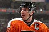 PHILADELPHIA - SEPTEMBER 29:  Mike Richards #18 of the Philadelphia Flyers looks on from the bench area during NHL preseason game action against the Minnesota Wild at the Wachovia Center on September 29, 2009 in Philadelphia, Pennsylvania.  The Wild defeated the Flyers 5-4 in shootout overtime. (Photo by Bruce Bennett/Getty Images)