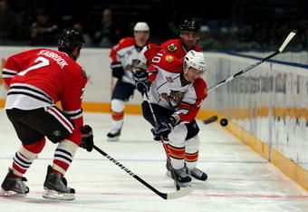 HELSINKI, FINLAND - OCTOBER 02:  David Booth #10 of the Florida Panthers battles with Brent Seabrook  #7 of the Chicago Blackhawks during The Compuware/NHL Premiere Helsinki series match at the Hartwall Areena on October 2, 2009 in Helsinki, Finland. The Compuware/NHL Premiere series is the first regular season NHL matches to be held in Helsinki.  (Photo by Richard Heathcote/ Getty Images)