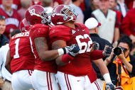 TUSCALOOSA, AL - OCTOBER 24:  Lorenzo Washington #97 celebrates with Terrence Cody #62 of the Alabama Crimson Tide after Cody blocked a field goal in the first half against the Tennessee Volunteers at Bryant-Denny Stadium on October 24, 2009 in Tuscaloosa, Alabama.  (Photo by Kevin C. Cox/Getty Images)