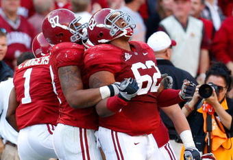 TUSCALOOSA, AL - OCTOBER 24:  Lorenzo Washington #97 celebrates with Terrence Cody #62 of the Alabama Crimson Tide after Cody blocked a field goal in the first half against the Tennessee Volunteers at Bryant-Denny Stadium on October 24, 2009 in Tuscaloosa, Alabama.  (Photo by Kevin C. Cox/Getty Images)
