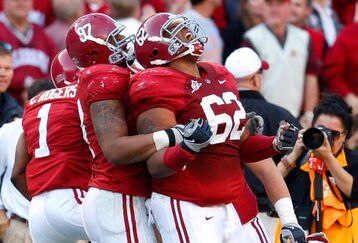TUSCALOOSA, AL - OCTOBER 24:  Lorenzo Washington #97 celebrates with Terrence Cody #62 of the Alabama Crimson Tide after Cody blocked a field goal in the first half against the Tennessee Volunteers at Bryant-Denny Stadium on October 24, 2009 in Tuscaloosa, Alabama.  (Photo by Kevin C. Cox/Getty Images)