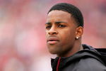 SAN FRANCISCO - OCTOBER 11:  Michael Crabtree, the San Francisco 49ers first round draft pick, watches the 49ers game against the Atlanta Falcons on the sidelines at Candlestick Park on October 11, 2009 in San Francisco, California.  (Photo by Ezra Shaw/Getty Images)