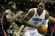 ORLANDO, FL - OCTOBER 29: Dwight Howard #2 of the Orlando Magic looks to go up against Josh Smith #5 the Atlanta Hawks at Amway Arena on October 29, 2008 in Orlando, Florida. NOTE TO USER: User expressly acknowledges and agrees that, by downloading and/or using this Photograph, user is consenting to the terms and conditions of the Getty Images License Agreement. (Photo by Doug Benc/Getty Images)