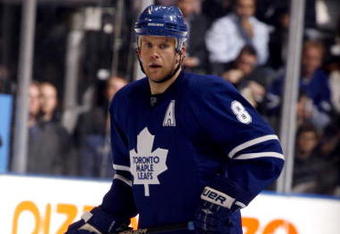 TORONTO - OCTOBER 17:  Mike Komisarek #8 of the Toronto Maple Leafs skates during a NHL game against the New York Rangers at the Air Canada Centre on October 17, 2009 in Toronto, Ontario, Canada .  (Photo by Abelimages/Getty Images) 