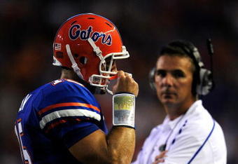 GAINESVILLE, FL - SEPTEMBER 05:  Florida Gator head coach Urban Meyer watches Tim Tebow #15 following a touchdown during the game against the Charleston Southern Buccaneers at Ben Hill Griffin Stadium on September 5, 2009 in Gainesville, Florida.  (Photo by Sam Greenwood/Getty Images)