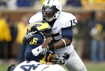ANN ARBOR, MI - OCTOBER 24:  Denard Robinson #16 of the Michigan Wolverines is tackled by Bani Gbadyu #15 and Josh Hull #43 of the Penn State Nittany Lions on October 24, 2009 at Michigan Stadium in Ann Arbor, Michigan.  (Photo by Gregory Shamus/Getty Images)