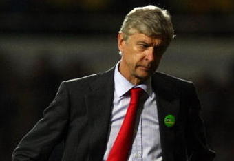 LONDON, ENGLAND - OCTOBER 25:  Arsenal manager Arsene Wenger reacts during the Barclays Premier League match between West Ham United and Arsenal at Boleyn Ground on October 25, 2009 in London, England.  (Photo by Clive Rose/Getty Images)