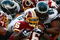 PHILADELPHIA - OCTOBER 05:  Clinton Portis #26 of the Washington Redskins is tackled by Mike Patterson #98 of the Philadelphia Eagles on October 5, 2008 at Lincoln Financial Field in Philadelphia, Pennsylvania.  (Photo by Chris McGrath/Getty Images)