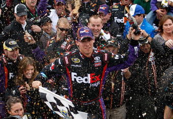 MARTINSVILLE, VA - OCTOBER 25:  Denny Hamlin, driver of the #11 FedEx Freight Toyota, celebrates in victory lane after winning the NASCAR Sprint Cup Series TUMS Fast Relief 500 at Martinsville Speedway on October 25, 2009 in Martinsville, Virginia.  (Photo by Streeter Lecka/Getty Images)