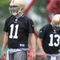 SANTA CLARA, CA - MAY 01:  Quarterbacks Alex Smith #11 and Shaun Hill #13 of the San Francisco 49ers look on during the 49ers Minicamp at their training facilities on May 1, 2009 in Santa Clara, California.  (Photo by Jed Jacobsohn/Getty Images)