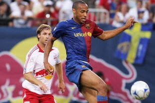 EAST RUTHERFORD, NJ - AUGUST 6: Thierry Henry #14 of the FC Barcelona plays the ball against the New York Red Bulls at Giants Stadium August 6, 2008 in East Rutherford, New Jersey. Barcelona defeated the Red Bulls 6-2. (Photo by Mike Stobe/Getty Images for New York Red Bulls)