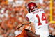 DALLAS - OCTOBER 17:  Quarterback Sam Bradford #14 of the Oklahoma Sooners is tackled by Lamarr Houston #33 of the Texas Longhorns at Cotton Bowl on October 17, 2009 in Dallas, Texas.  (Photo by Ronald Martinez/Getty Images)