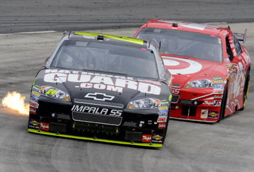 MARTINSVILLE, VA - OCTOBER 25:  Jeff Gordon, driver of the #24 DuPont/NationalGuard.com Chevrolet, races Juan Pablo Montoya, driver of the #42 Target Chevrolet, during the NASCAR Sprint Cup Series TUMS Fast Relief 500 at Martinsville Speedway on October 25, 2009 in Martinsville, Virginia.  (Photo by John Harrelson/Getty Images)
