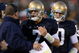SOUTH BEND, IN - OCTOBER 17: Head coach Charlie Weis of the Notre Dame Fighting Irish speaks to quarterback Jimmy Clausen #7 during the fourth quarter against the USC Trojans at Notre Dame Stadium on October 17, 2009 in South Bend, Indiana. USC won the game 34-27. (Photo by Jonathan Daniel/Getty Images)