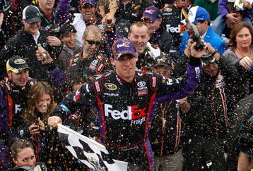 MARTINSVILLE, VA - OCTOBER 25:  Denny Hamlin, driver of the #11 FedEx Freight Toyota, celebrates in victory lane after winning the NASCAR Sprint Cup Series TUMS Fast Relief 500 at Martinsville Speedway on October 25, 2009 in Martinsville, Virginia.  (Photo by Streeter Lecka/Getty Images)