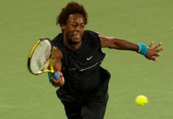 SHANGHAI, CHINA - OCTOBER 15: Gael Monfils of France returns a ball to Ivan Ljubicic of Croatia during day five of 2009 Shanghai ATP Masters 1000 at Qi Zhong Tennis Centre on October 15, 2009 in Shanghai, China.  (Photo by Victor Fraile/Getty Images)
