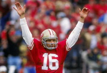 13 Jan 1991:  Quarterback Joe Montana of the San Francisco 49ers raises his hands in celebration after throwing a touch down pass in the 49ers 28-10 victory over the Washington Redskins at RFK Stadium in Washington D.C. Mandatory Credit: Otto Greule Jr.