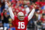 13 Jan 1991:  Quarterback Joe Montana of the San Francisco 49ers raises his hands in celebration after throwing a touch down pass in the 49ers 28-10 victory over the Washington Redskins at RFK Stadium in Washington D.C. Mandatory Credit: Otto Greule Jr.