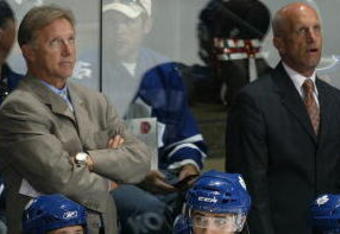 LONDON, ON - SEPTEMBER 17:  Coaches Tim Hunter, Ron Wilson and Keith Acton of the Toronto Maple Leafs concentrate on a replay on score board in a pre-season game against the Philadelphia Flyers on September 17, 2009 at the John Labatt Centre in London, Ontario. The Leafs defeated the Flyers 4-0. (Photo by Claus Andersen/Getty Images)
