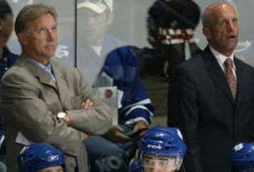 LONDON, ON - SEPTEMBER 17:  Coaches Tim Hunter, Ron Wilson and Keith Acton of the Toronto Maple Leafs concentrate on a replay on score board in a pre-season game against the Philadelphia Flyers on September 17, 2009 at the John Labatt Centre in London, Ontario. The Leafs defeated the Flyers 4-0. (Photo by Claus Andersen/Getty Images)