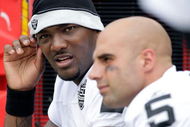 KANSAS CITY, MO - SEPTEMBER 20:  Quarterback JaMarcus Russell #2 of the Oakland Raiders talks with Bruce Gradkowski #5 on the bench during the game against the Kansas City Chiefs at Arrowhead Stadium on September 20, 2009 in Kansas City, Missouri.  (Photo by Jamie Squire/Getty Images)