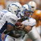 KNOXVILLE, TN - SEPTEMBER 9: Quarterback Shaun Carney #5 of the Air Force Academy Falcons hands off to running back Ryan Williams #21 against the University of Tennessee Volunteers on September 9, 2006 at Neyland Stadium in Knoxville, Tennessee.  (Photo by Stephen Dunn/Getty Images)