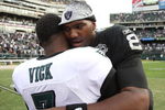 OAKLAND, CA - OCTOBER 18:  Michael Vick #7 of the Philadelphia Eagles talks with JaMarcus Russell #2 of the Oakland Raiders at the end of an NFL game at the Oakland-Alameda County Coliseum on October 18, 2009 in Oakland, California.  (Photo by Jed Jacobsohn/Getty Images)