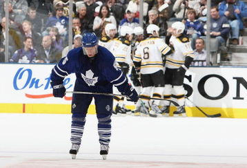 TORONTO - MARCH 28:  Jason Blake #55 of the Toronto Maple Leafs hangs his head as members of the Boston Bruins celebrate a 2nd period goal during their NHL game at the Air Canada Centre March 28, 2009 in Toronto, Ontario.(Photo By Dave Sandford/Getty Images)
