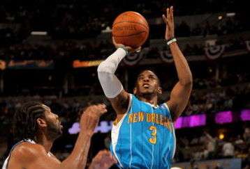 DENVER - APRIL 29:  Chris Paul #3 of the New Orleans Hornets takes a shot Nene #31 of the Denver Nuggets defends in Game Five of the Western Conference Quarterfinals during the 2009 NBA Playoffs at Pepsi Center on April 29, 2009 in Denver, Colorado. The Nuggets defeated the Hornets 107-86. NOTE TO USER: User expressly acknowledges and agrees that, by downloading and or using this photograph, User is consenting to the terms and conditions of the Getty Images License Agreement.  (Photo by Doug Pensinger/Getty Images)