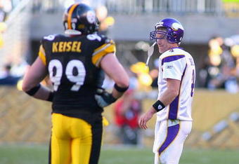 PITTSBURGH - OCTOBER 25: Brett Favre #4  of the Minnesota Vikings walks off the field past Brett Keisel #99 of the Pittsburgh Steelers after Keyaron Fox #57 (not shown) intercepted  Favre and returned it for a touchdown at Heinz Field on October 25, 2009 in Pittsburgh, Pennsylvania.  (Photo by Rick Stewart/Getty Images)