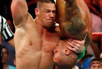 LAS VEGAS - AUGUST 24:  Wrestler John Cena picks up wrestler Randy Orton during the WWE Monday Night Raw show at the Thomas & Mack Center August 24, 2009 in Las Vegas, Nevada.  (Photo by Ethan Miller/Getty Images)