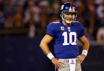 EAST RUTHERFORD, NJ - OCTOBER 25:  Eli Manning #10 of the New York Giants reacts after a bad pass against the Arizona Cardinals on October 25, 2009 at Giants Stadium in East Rutherford, New Jersey.  (Photo by Chris McGrath/Getty Images)