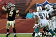 MIAMI - OCTOBER 25:  Quarterback Drew Brees #9 of the New Orleans Saints throws a pass against the Miami Dolphins at Land Shark Stadium on October 25, 2009 in Miami, Florida. The Saints defeated the Dolphins 46-34.  (Photo by Doug Benc/Getty Images)