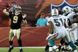 MIAMI - OCTOBER 25:  Quarterback Drew Brees #9 of the New Orleans Saints throws a pass against the Miami Dolphins at Land Shark Stadium on October 25, 2009 in Miami, Florida. The Saints defeated the Dolphins 46-34.  (Photo by Doug Benc/Getty Images)