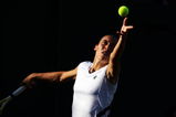 WIMBLEDON, ENGLAND - JUNE 26:  Francesca Schiavone of Italy serves during the women's singles third round match against Marion Bartoli of France on Day Five of the Wimbledon Lawn Tennis Championships at the All England Lawn Tennis and Croquet Club on June 26, 2009 in London, England.  (Photo by Julian Finney/Getty Images)