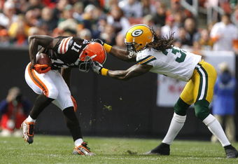 CLEVELAND, OH - OCTOBER 25:  Al Harris #31 of the Green Bay Packers tackles Mohamed Massaquoi #11 of the Cleveland Browns at Cleveland Browns Stadium on October 25, 2009 in Cleveland, Ohio.  (Photo by Matt Sullivan/Getty Images)