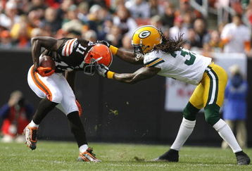 CLEVELAND, OH - OCTOBER 25:  Al Harris #31 of the Green Bay Packers tackles Mohamed Massaquoi #11 of the Cleveland Browns at Cleveland Browns Stadium on October 25, 2009 in Cleveland, Ohio.  (Photo by Matt Sullivan/Getty Images)