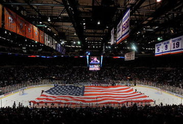 UNIONDALE, NY - OCTOBER 03:  A large American Flag is carried on the ice for the National Anthem during festivities before the home opener NHL hockey game betwen the New York Islanders and the Pittsburgh Penguins on October 3, 2009 at the Nassau Coliseum in Uniondale, New York. The Penguins defeated the Islanders 4-3 in shootout overtime.  (Photo by Paul Bereswill/Getty Images)
