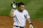 NEW YORK - OCTOBER 25:  Nick Swisher #33 of the New York Yankees walks off after striking out in the bottom of the fifth inning against the Los Angeles Angels of Anaheim in Game Six of the ALCS during the 2009 MLB Playoffs at Yankee Stadium on October 25, 2009 in the Bronx borough of New York City.  (Photo by Jim McIsaac/Getty Images)