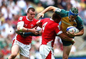 LONDON, ENGLAND - MAY 23:  Will Brock of Australia is tackled during the IRB London Sevens game between Australia and Wales at Twickenham Stadium on May 23, 2009 in London, England.  (Photo by John Gichigi/Getty Images)