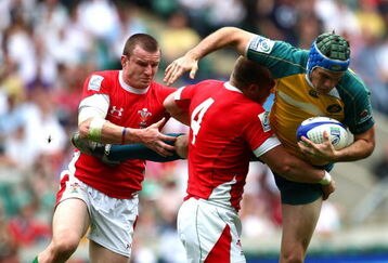 LONDON, ENGLAND - MAY 23:  Will Brock of Australia is tackled during the IRB London Sevens game between Australia and Wales at Twickenham Stadium on May 23, 2009 in London, England.  (Photo by John Gichigi/Getty Images)