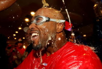 PHILADELPHIA - OCTOBER 21:  Jimmy Rollins #11 of the Philadelphia Phillies is sprayed down with champagne as they celebrate defeating the Los Angeles Dodgers 10-4 to advance to the World Series in Game Five of the NLCS during the 2009 MLB Playoffs at Citizens Bank Park on October 21, 2009 in Philadelphia, Pennsylvania.  (Photo by Nick Laham/Getty Images)