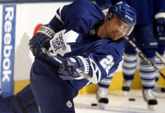 TORONTO - SEPTEMBER 22:  Francois Beauchemin #22 of the Toronto Maple Leafs shoots during warmup before playing the Pittsburgh Penguins during a pre-season  NHL game at the Air Canada Centre on September 22, 2009 in Toronto, Ontario, Canada .  (Photo by Abelimages/Getty Images) 