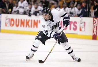 BOSTON - MARCH 17:  Bobby Butler #12 of the New Hampshire Wildcats handles the puck during the Hockey East Tournament on March 17,2007 at TD Banknorth Garden in Boston, Massachusetts. Boston College defeated New Hampshire 5-2 to win the Hockey East championship game. (Photo by Elsa/Getty Images)