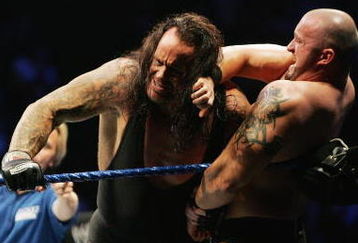 SYDNEY, AUSTRALIA - JUNE 15:  The Undertaker (L) pushes Bam Neely into the corner during WWE Smackdown at Acer Arena on June 15, 2008 in Sydney, Australia.  (Photo by Gaye Gerard/Getty Images)