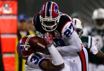 EAST RUTHERFORD, NJ - OCTOBER 18:  Reggie Corner #27, with the help of Jairus Byrd #31, of the Buffalo Bills catches an interception against the New York Jets during overtime on October 18, 2009 at Giants Stadium in East Rutherford, New Jersey. The Bills defeated the Jets 16-13 in overtime.  (Photo by Jared Wickerham/Getty Images)