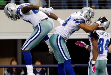 ARLINGTON, TX - OCTOBER 25:  Miles Austin (C) #19 of the Dallas Cowboys celebrates a touchdown with Martellus Bennett #80 and Patrick Crayton #84 against the Atlanta Falcons at Cowboys Stadium on October 25, 2009 in Arlington, Texas.  (Photo by Ronald Martinez/Getty Images)